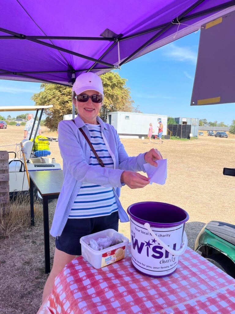 Christine putting money in the pot